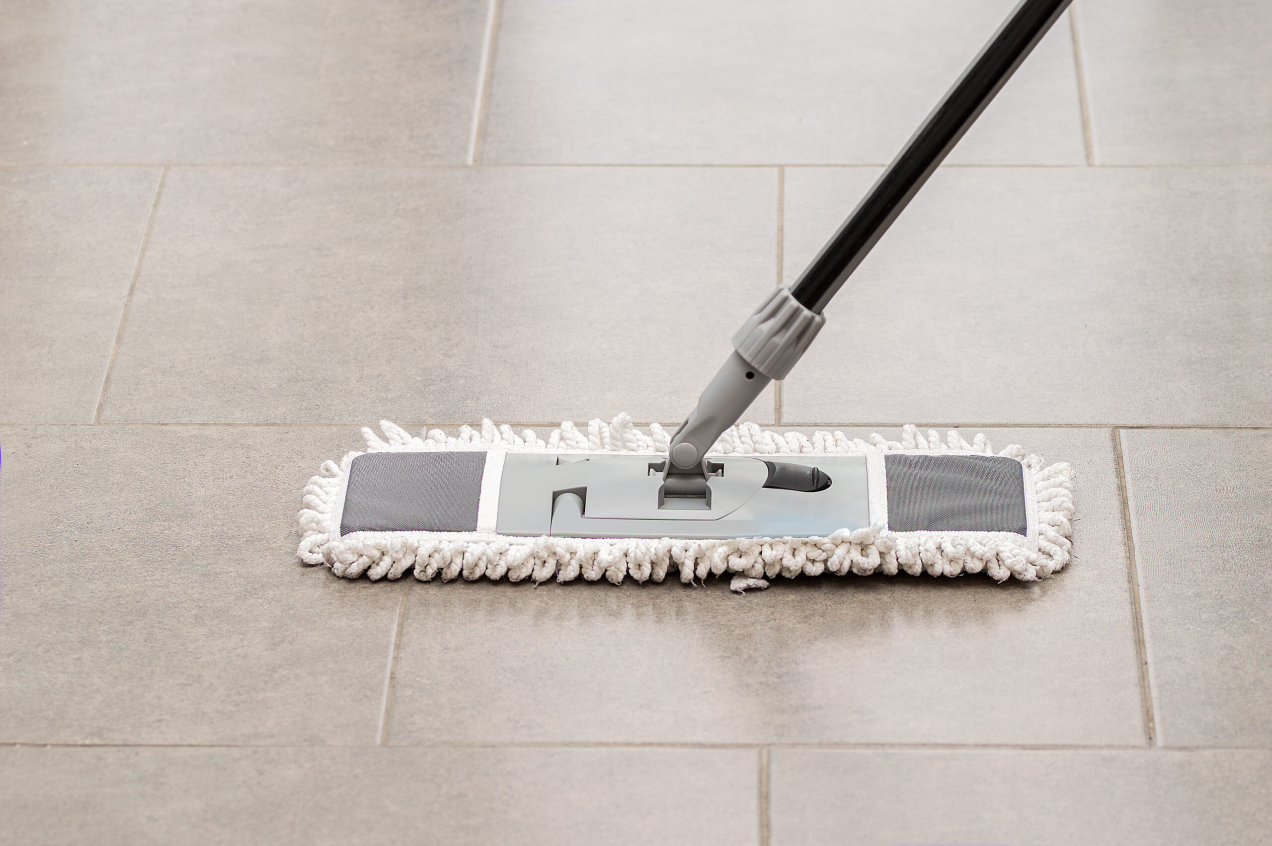 Cleaning Gear Mopping A Living Room Floor With Tile